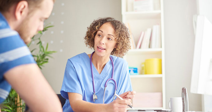 Man speaking with healthcare professional